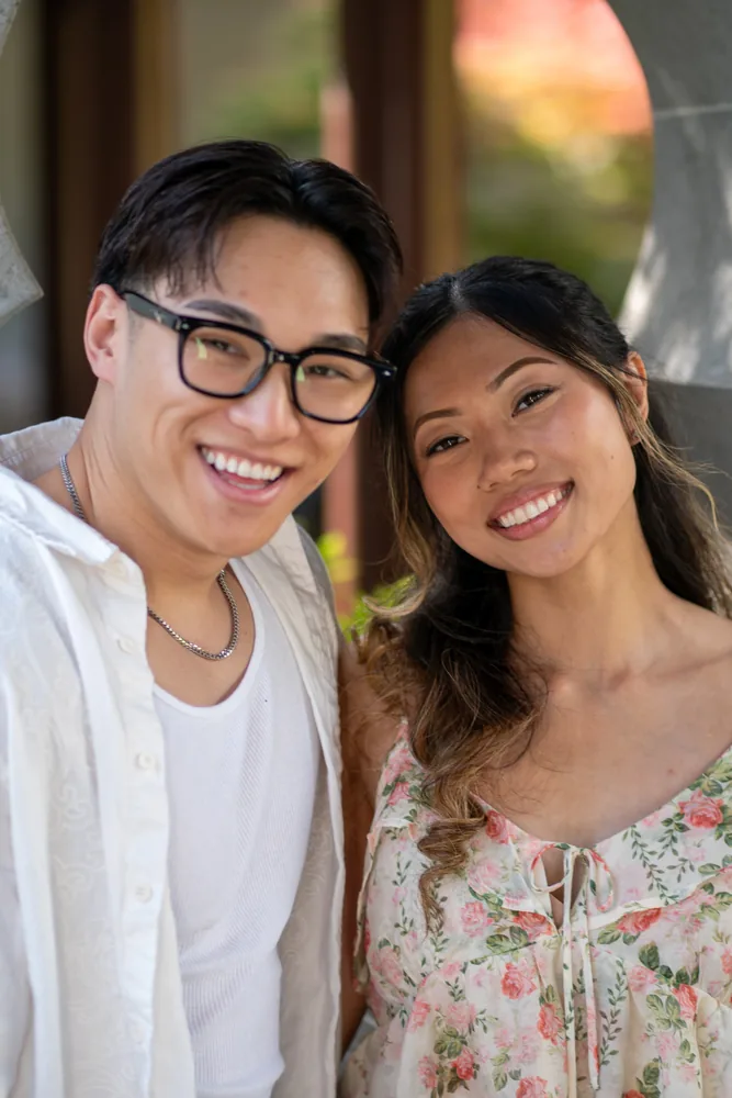 A smiling couple photographed outdoors